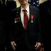 World War II veteran Glenn Dickerson poses for a picture with other after the award ceremony on Tuesday. Daniel Brenner I AnnArbor.com
